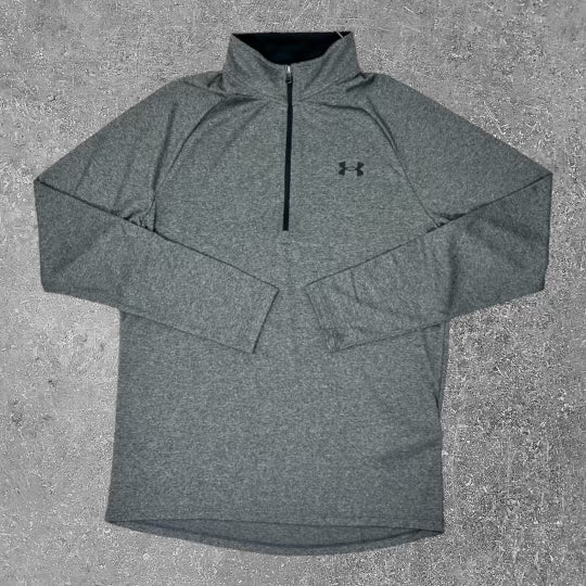 UA tech half zip in grey offers a perfect fit for running.