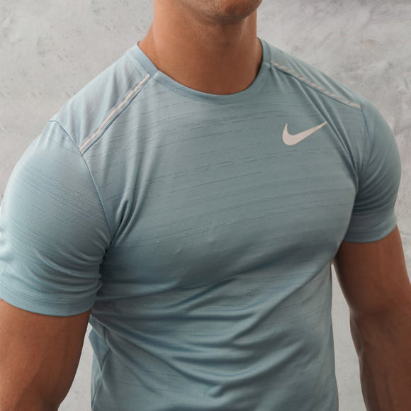 This Nike miler 1.0 worn blue T-Shirt is a premium piece of activewear.