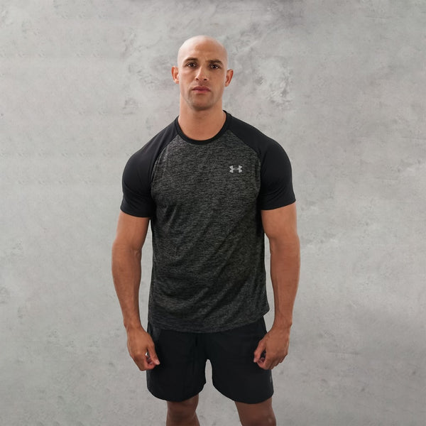 UA tech t-shirt in dark grey colourway is worn by lots of people in gyms.