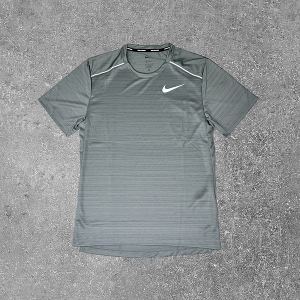 This Nike miler 1.0 T-shirt in grey is an athletic fit.